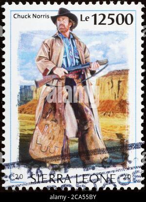 Chuck Norris as cowboy on postage stamp Stock Photo