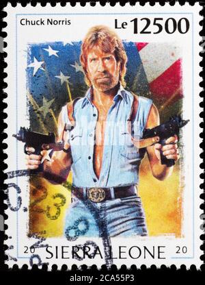 Portrait of Chuck Norris on postage stamp Stock Photo