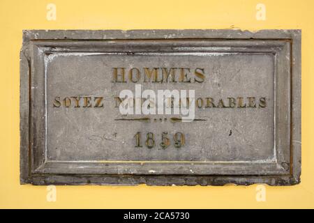France, Aisne, Guise, Familistere, museum Godin stoves, wall plaque with Hommes Soyez nous Favorables 1859 Stock Photo