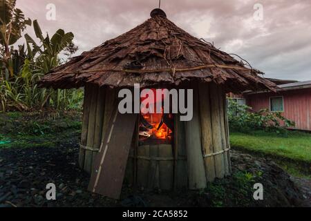 Indonesia, Papua, Baliem valley, near Wamena, Yali people territory, Angguruk village, round hut called honai, wood fire cooking, altitude 1450 m Stock Photo
