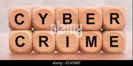 cyber crime printed on wooden cubes Stock Photo