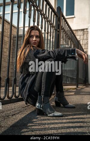 Premium Photo  Photo of a young woman in white boots and casual