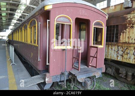 Wagon. Vintage restored antique carriage in a train station, with view from platform at Museum of railroad in interior Brazil, South America, rear vie Stock Photo