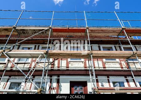 scaffolding at half-timbered house currently under renovation Stock Photo