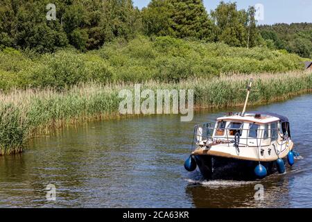 motorboat on the river Elde in the Mecklenburg Lake District, Germany Stock Photo