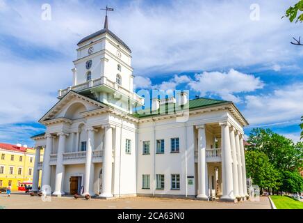 Town Hall building on Freedom Svabody square in Upper Town Minsk historical city centre, blue sky white clouds in sunny summer day, Republic of Belarus Stock Photo