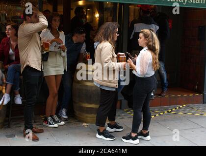 As evening draws in, Soho comes to life again on ‘Super Saturday’ as people visit pubs after the Covid-19 lockdown rules have been relaxed by the Government. Featuring: Atmosphere Where: London, United Kingdom When: 04 Jul 2020 Credit: Mario Mitsis/WENN Stock Photo