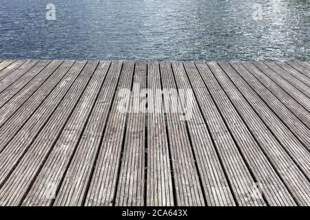 wooden planks of a jetty at lake for background use Stock Photo