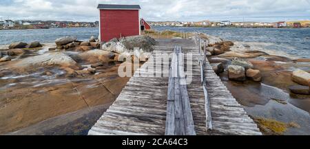 View of fishing stage on sea coastline, Tilting, Fogo Island, Newfoundland Stock Photo
