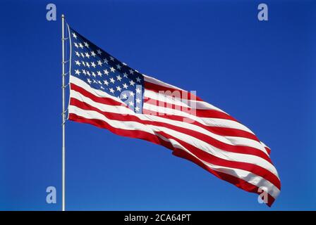 View of American Flag blowing in wind Stock Photo