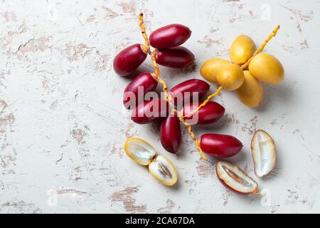 yellow and red fresh dates fruit isolate on white background Stock Photo