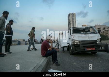 Beirut, Lebanon. 04th Aug, 2020. People inspect a damaged van following a massive explosion in Beirut's port. Credit: Marwan Naamani/dpa/Alamy Live News Stock Photo