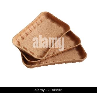 Biodegradable food trays made from pressed cardboard isolated on white background. Closeup Stock Photo