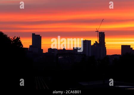 Sunrise over Leeds City Centre. The tall building to the right is Altus House and is now the tallest building in Yorkshire Stock Photo