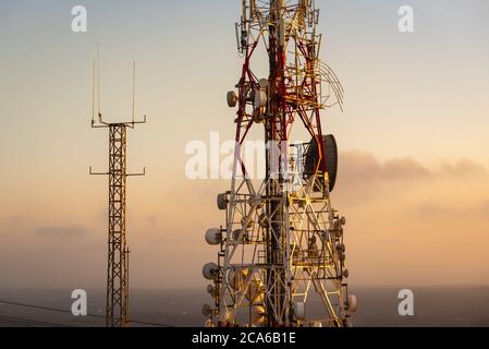 Telecommunications mast - directional mobile phone antenna dishes. Stock Photo