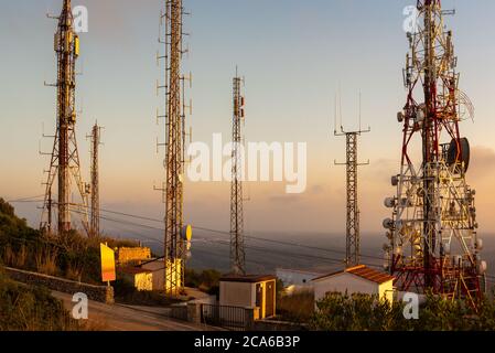 Telecommunications masts - directional mobile phone antenna dishes. Stock Photo