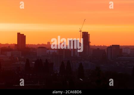 Sunrise over Leeds City Centre. The tall building to the right is Altus House and is now the tallest building in Yorkshire Stock Photo