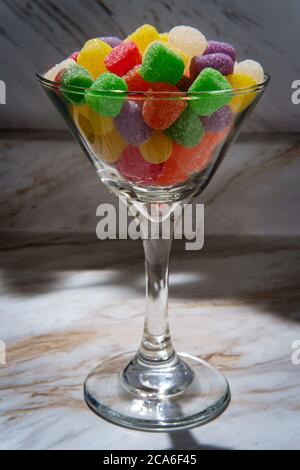 Granulated sugar coated candy gumdrops martini glass Stock Photo