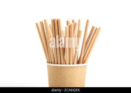 Part of eco friendly paper craft cup for coffee with many drink tubules isolated on the white background. Zero waste, plastic free concept. Sustainabl Stock Photo