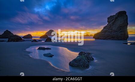 Face Rock and sea stacks at sunset; Face Rock State Wayside, Bandon Beach, southern Oregon Coast. Stock Photo