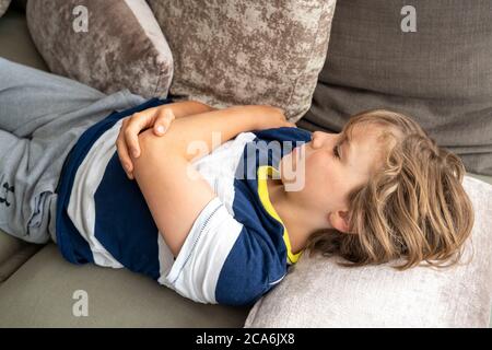 Growth pain in children, boy, 10 years old, has pain in the leg, symbolic image, Stock Photo