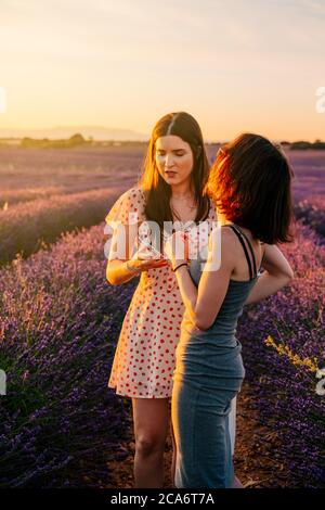 girlfriends having fun and enjoying a walk in the lavender fields, Nature holidays, Spain Stock Photo