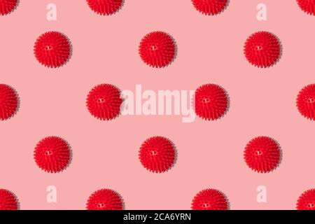 Seamless pattern with red coronavirus molecules on a pink background. Covid-19, healthcare concept. Abstract background. Stock Photo