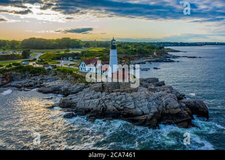 Aerial view of Portland Head Lighthouse at sunset in Fort Williams Park, Cape Elizabeth, Maine, located at the entrance into Portland Harbor. Stock Photo