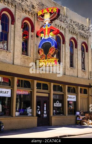 Bright neon light cowboy sign outside the Boots and Hats store on 3rd street in downtown Nashville, TN Stock Photo