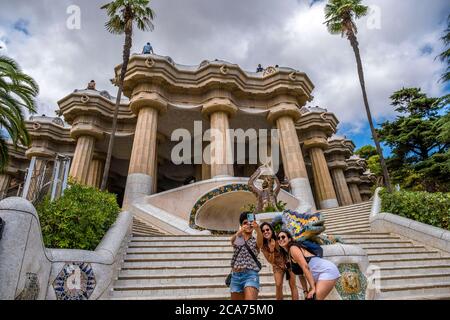 Tourists are seen taking a selfie on the dragon staircase in Park Güell in Barcelona designed by Antoni Gaudí.Despite having free access for residents of Barcelona during the summer, Park Güell, one of the most visited spaces in the city of Barcelona, has a low attendance of tourists and visitors due to Covid-19 contagion outbreaks. Stock Photo