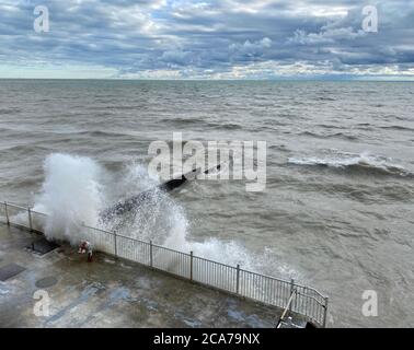 Wind advisory on Lake Michigan brings high waves to the Illinois shore on a summer day