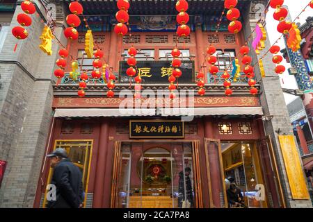 Tianjin, China - Jan 16 2020: Unidentified people with street vendors at Guwenhua Jie pedestrian pathway  in Nankai District Stock Photo