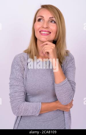 Girl With Blond Hair And Gray Sweater Poses Stock Photo Alamy