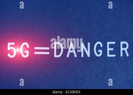 Modern communication technologies 5G logo with the inscription danger Stock Photo