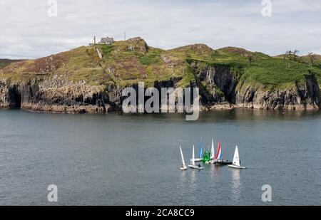 Baltimore, Cork, Ireland. 03rd May,2020. Sailing boats at the mouth of the harbour with Sherkin Island in the background in Baltimore, Co. Cork, Irela Stock Photo