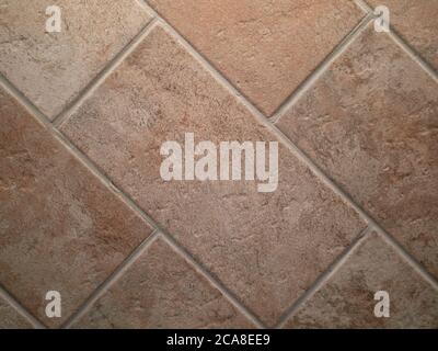 closeup of terracotta flooring after restoration, with rectangular tiles Stock Photo