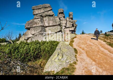 Hikers at Three Piglets rock formation, Karkonosze range, Sudetes mountains, Karkonosze National Park, Lower Silesia, Poland Stock Photo