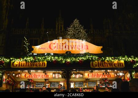 MUNICH, GERMANY - NOVEMBER 28, 2017 : Traditional Christmas market on Marienplatz in Munich by night. Stand with mulled wine, Munchner Gluhwein. Stock Photo