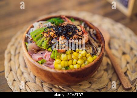 Poke bowl with shrimp, corn, avocado, ginger and mushrooms Stock Photo