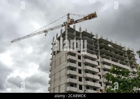New multi storey residential building. Windows and walls in a house under construction. Modern civil engineering. Buildings industry. Urban constructi Stock Photo