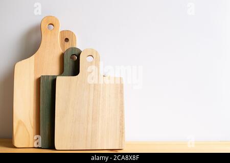 Wooden tray, cutting board, plate on wooden table with white background Stock Photo