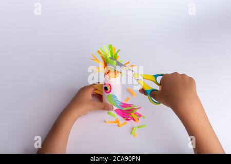 Paper crafts for children. Application of children's creativity.  Kindergarten and craft school. On a beige background, a funny face of a man  made of colored paper. 18906892 Stock Photo at Vecteezy