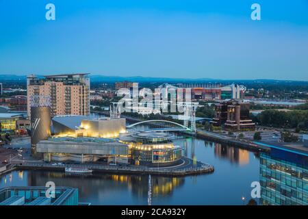 View of Salford Quays looking towards the Lowry Theatre and Old Trafford, Manchester, England, United Kingdom, Europe Stock Photo