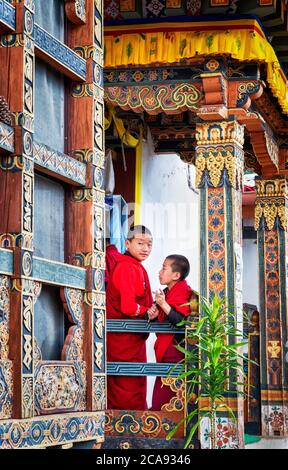 Novice Buddhist monks, Chimi Lhakhang Monastery, also known as the Fertility Temple, Punakha District, Bhutan, Asia Stock Photo