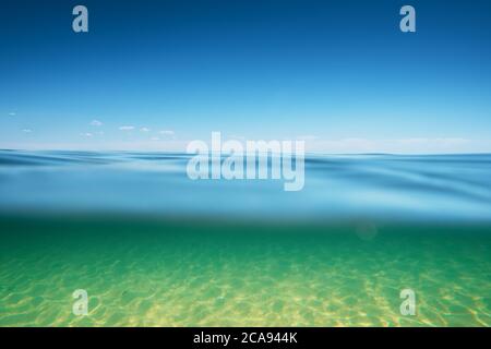 Sea water surface with underwater deep space Stock Photo