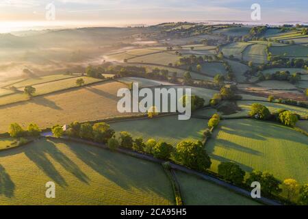 Beautiful morning sunlight over rolling countryside in spring, South Tawton, Devon, England, United Kingdom, Europe Stock Photo