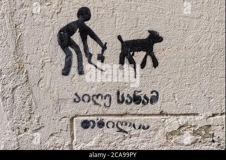 No dog pooping warning sign painted on a wall, Old Tbilisi Georgia, Caucasus, Middle East, Asia Stock Photo