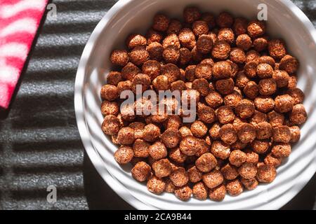 Chocolate balls cereal breakfast light through top view blinds Stock Photo