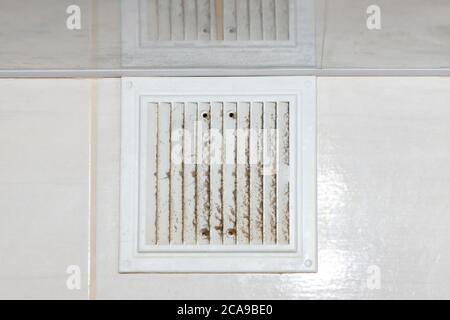 ventilation grill in the dust of dirt in the kitchen, close-up Stock Photo