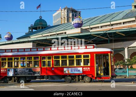New Orleans - 04/15/2018 : a red old tram stop in front of Harrah Casino in Canal Street Stock Photo